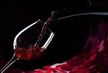 bottle and glass with red wine - obrazy, fototapety, plakaty