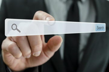 Businessman pointing at search bar