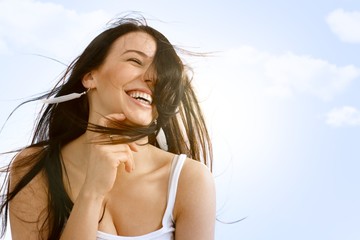 Beautiful woman enjoying wind and summer