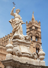 Fototapeta na wymiar Palermo - Towers of Cathedral or Duomo and Santa Rosalia statue
