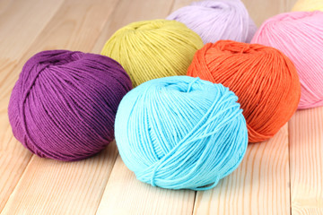 Knitting yarn on wooden background