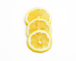 Slices of lemon fruit on white background
