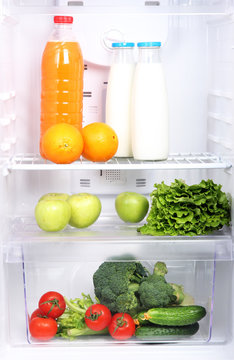 Open refrigerator with vegetarian (diet) food