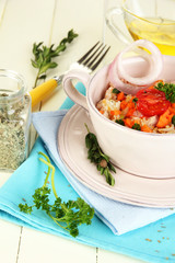 Delicious rice with vegetables and herbs in pot