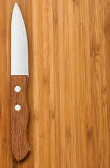 Wooden background with knife