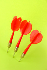 Darts on green background