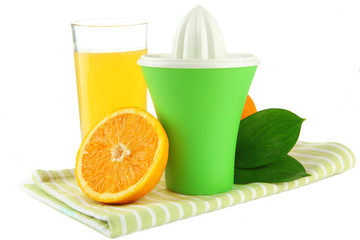 Citrus press, glass of juice and ripe oranges, isolated on
