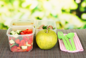 Tasty lunch in plastic containers,