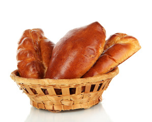 Tasty buns in wicker basket isolated on white