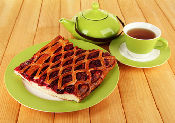 Cherry Pie with tea on table close-up