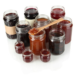 Tasty jam in banks isolated on white