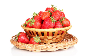 Fresh strawberry in wicker basket isolated on white