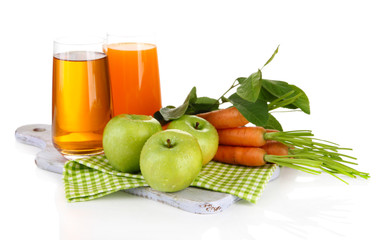 Glasses of juice, apples and carrots, isolated on white