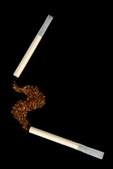 Tobacco and hand-rolled cigarette, isolated on black