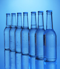 Water bottles on blue background
