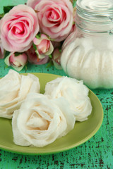 Sugar roses and natural roses, glass jar with sugar,