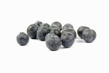 Close up of blueberries on the white background