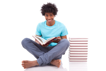 Young black teenage student men reading a books - African people