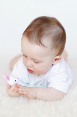 baby with toy rabbit