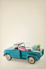 Toy truck packed with colorful furniture