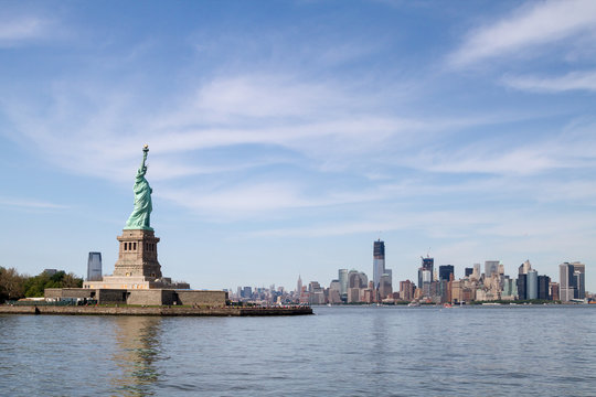Statue of Liberty, and Manhattan Skyline behind it