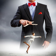 Businessman puppeteer
