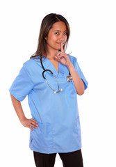 Charming asiatic nurse woman requesting silence