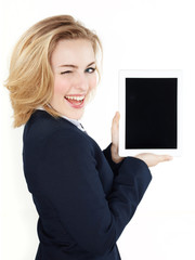 Business woman winking over her tablet pc with copyspace © Karin & Uwe Annas