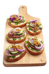 Sandwiches with sausage and onion