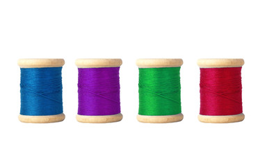 Few color bobbins isolated on white