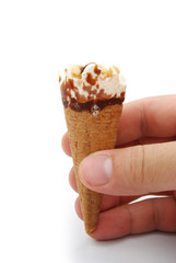 hand holding a mini ice cream with clipping path