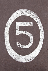 Fototapeta premium Number five painted on the ground