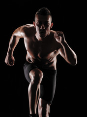 Fototapeta na wymiar Hombre atleta corredor ejercitando.