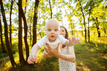 Mother with her child take rest in park