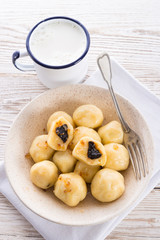 Potato dumplings with plums full