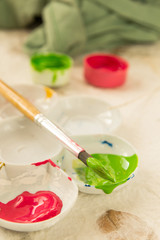 paintbrush and ink in the palette