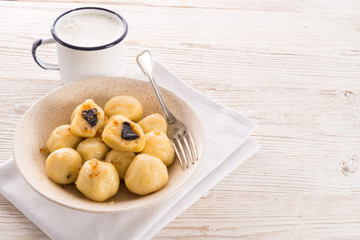 Potato dumplings with plums full