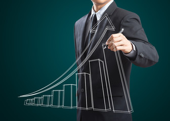 Male hand drawing a growth graph