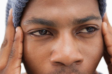 Man in beanie hat looking upset
