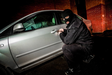 Car thief in a mask.
