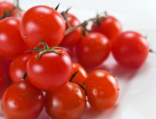 tomatoes “cherry” on a white plate