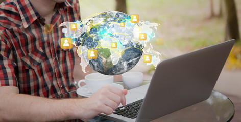 Social networking concept : Business man working with laptop (El