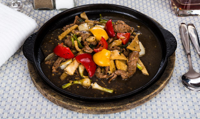 Deer fried  served on iron hot plate