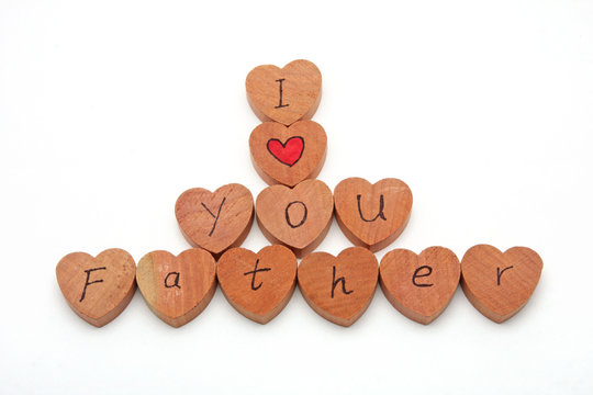 Wooden heart shape block with I love you text