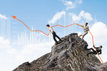 Businesspeople pulling graph