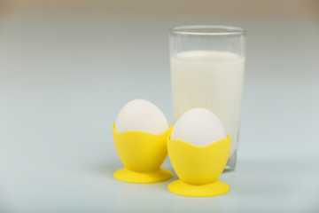Milk in a glass jar and eggs