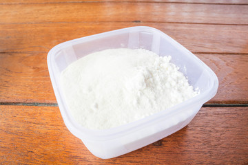 Fototapeta na wymiar Bakery mix flour measured in plastic box