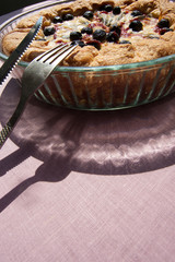 Pia  into a glass dish on the table, near knife, fork.