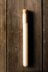 Sea salt in beaker on wooden table