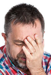 Fototapeta premium Elderly man suffering from a headache. Isolated on white